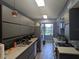 Sleek, modern kitchen boasts gray cabinetry, stainless steel appliances, and stylish countertops at 4705 Ne 1St Ne St # 327, St Petersburg, FL 33703