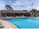 Inviting community pool with a lounge area and clubhouse, perfect for relaxation at 4705 Ne 1St Ne St # 327, St Petersburg, FL 33703