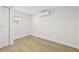 Bedroom featuring light wood flooring and mini-split air conditioning unit at 4755 21St N Ave, St Petersburg, FL 33713