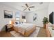 Stylishly decorated bedroom featuring modern furniture, wood floors, natural lighting, and white walls at 4755 21St N Ave, St Petersburg, FL 33713