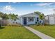 Charming single-story home with a well-manicured lawn and inviting walkway at 4755 21St N Ave, St Petersburg, FL 33713