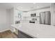 Spacious kitchen featuring stainless steel appliances, a gray kitchen island, and white cabinets at 4755 21St N Ave, St Petersburg, FL 33713