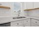 Close up of a kitchen sink with marble countertops, subway tile backsplash, and updated fixtures at 4755 21St N Ave, St Petersburg, FL 33713