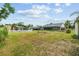 Spacious backyard with multiple buildings, offering great potential for outdoor enjoyment at 5112 Parkway Blvd, Land O Lakes, FL 34639