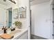 Well-lit bathroom with vanity sink, mirror, and modern fixtures at 5112 Parkway Blvd, Land O Lakes, FL 34639