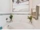 Close-up of a bathtub featuring tiled walls, plants and decor at 5112 Parkway Blvd, Land O Lakes, FL 34639