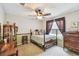 Charming bedroom with a ceiling fan, window, decorative furniture, and neutral tones for a cozy feel at 5112 Parkway Blvd, Land O Lakes, FL 34639