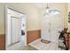 Inviting foyer featuring a double door entry, tile flooring, and neutral wall colors, creating a welcoming atmosphere at 5112 Parkway Blvd, Land O Lakes, FL 34639