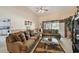 Spacious living room with plush seating, neutral decor, and an open layout, perfect for relaxation and entertaining at 5112 Parkway Blvd, Land O Lakes, FL 34639