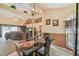 Open-concept living area with dining set offers a view to an adjoining room, perfect for entertaining and relaxation at 5112 Parkway Blvd, Land O Lakes, FL 34639