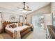 Comfortable main bedroom with large windows, a cozy bed, and ample natural light, creating a relaxing atmosphere at 5112 Parkway Blvd, Land O Lakes, FL 34639