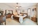 Spacious main bedroom with vaulted ceilings, large windows, and elegant decor, offering a serene retreat at 5112 Parkway Blvd, Land O Lakes, FL 34639
