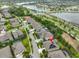 Aerial view of beautiful house with a driveway near a lake and a highway at 6016 Shadowlake Dr, Apollo Beach, FL 33572