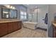 Beautiful bathroom featuring double vanity, soaking tub and glass-enclosed shower at 6016 Shadowlake Dr, Apollo Beach, FL 33572