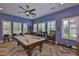 Game room with pool table, plenty of seating and great natural light at 6016 Shadowlake Dr, Apollo Beach, FL 33572
