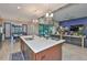 Open kitchen with island and modern appliances at 6016 Shadowlake Dr, Apollo Beach, FL 33572