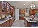 Well-equipped kitchen with wood cabinets and stainless steel appliances at 6016 Shadowlake Dr, Apollo Beach, FL 33572