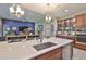 Spacious kitchen with island and view into living room at 6016 Shadowlake Dr, Apollo Beach, FL 33572