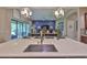 Modern kitchen with large island, stainless steel appliances, and an open view into the living area at 6016 Shadowlake Dr, Apollo Beach, FL 33572