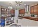 Modern kitchen with island, stainless steel appliances, and stylish pendant lighting at 6016 Shadowlake Dr, Apollo Beach, FL 33572