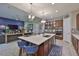 Bright kitchen with island and stainless steel appliances at 6016 Shadowlake Dr, Apollo Beach, FL 33572