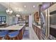 Open kitchen with island seating and stainless steel appliances at 6016 Shadowlake Dr, Apollo Beach, FL 33572