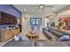 Spacious living room featuring a large sectional sofa and modern ceiling fan at 6016 Shadowlake Dr, Apollo Beach, FL 33572