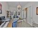 Bright office space features a unique chandelier, and a spacious desk at 6016 Shadowlake Dr, Apollo Beach, FL 33572