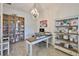 Bright office space features shelving for decor and a spacious desk at 6016 Shadowlake Dr, Apollo Beach, FL 33572