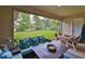 Inviting covered patio with comfortable seating, dining table, and view of the backyard at 6016 Shadowlake Dr, Apollo Beach, FL 33572