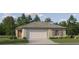 Charming single-story home featuring a two-car garage and a well-manicured lawn at 6496 Propel Run, New Port Richey, FL 34655