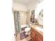 Cozy bathroom featuring a tub with shower and a granite vanity at 6801 S Sparkman St, Tampa, FL 33616