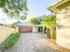 Long brick driveway leading to a spacious two car garage at 6801 S Sparkman St, Tampa, FL 33616