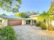 Long brick driveway leading to a spacious two car garage at 6801 S Sparkman St, Tampa, FL 33616