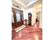 Grand entryway featuring hardwood floors and detailed trim, offering a warm welcome at 6801 S Sparkman St, Tampa, FL 33616