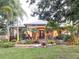 Inviting front yard with lush tropical landscaping and a double-door entry at 6801 S Sparkman St, Tampa, FL 33616