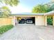Spacious two car garage with a car parked in each bay at 6801 S Sparkman St, Tampa, FL 33616