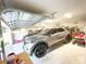 A two car garage with vehicles parked inside and plenty of storage space at 6801 S Sparkman St, Tampa, FL 33616