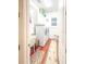 Bright laundry room boasts white cabinets, modern washer and dryer, and a utility sink at 6801 S Sparkman St, Tampa, FL 33616