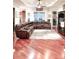 Spacious living room featuring a brown leather sofa and wood floors at 6801 S Sparkman St, Tampa, FL 33616