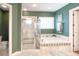 Serene main bathroom boasts a soaking tub, a separate shower, and natural light at 6801 S Sparkman St, Tampa, FL 33616