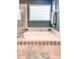 Well lit main bathroom with a glass enclosed shower and soaking tub with tile surround at 6801 S Sparkman St, Tampa, FL 33616