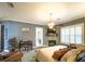 Main bedroom showcases a fireplace, ceiling fan, sitting area, and access to the outdoors at 6801 S Sparkman St, Tampa, FL 33616