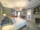 Bright main bedroom with a fireplace, ceiling fan, sitting area, and access to the outdoors at 6801 S Sparkman St, Tampa, FL 33616