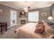 Spacious main bedroom features a fireplace, plantation shutters, ceiling fan, and private patio access at 6801 S Sparkman St, Tampa, FL 33616