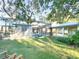 Backyard view of screened pool and covered walkway at 6801 S Sparkman St, Tampa, FL 33616
