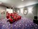 Home theater boasting luxury red recliners and cinema-themed decor for immersive viewing at 6801 S Sparkman St, Tampa, FL 33616