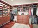 A beautiful walk-in closet provides an abundance of storage with custom shelves and drawers at 6801 S Sparkman St, Tampa, FL 33616