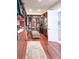This walk-in closet features custom shelving and drawers for ample storage, with cherry wood floors at 6801 S Sparkman St, Tampa, FL 33616