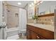 Bathroom featuring a shower and tub combo with a single sink vanity at 715 45Th Ne Ave, St Petersburg, FL 33703